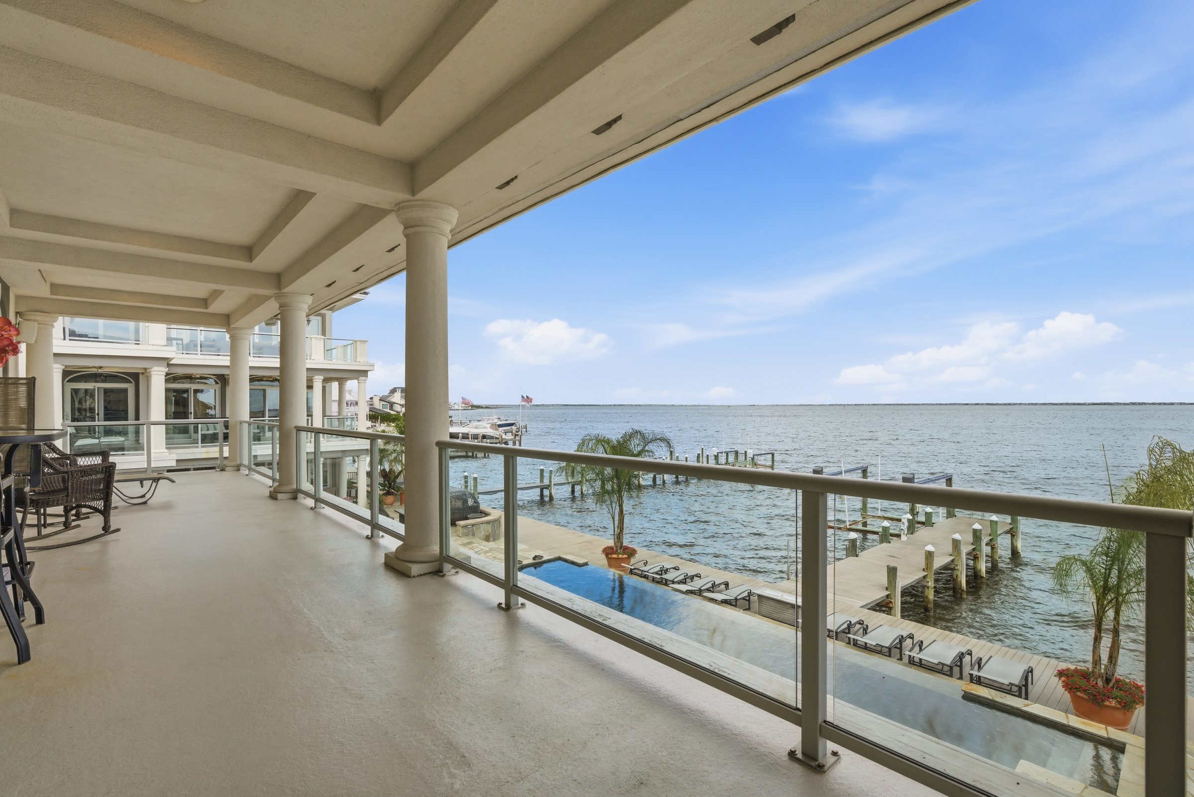 guest house balcony connecting the upstairs bedrooms with water views